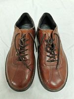 Top view of pair of brown leather Ecco men's shoes size 42 EU / 8.5 US, showing laces and toe design