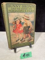 Front cover of the 1916 hardcover book with illustrated children on the farm.