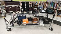 Overview of lot items on metal shelving