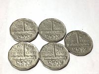 Reverse side showing the 1751-1951 commemorative design with maple leaves on Canadian nickels.