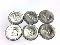 Reverse side of six Canadian 5 cent commemorative nickels featuring rabbit/hare designs and date ranges from 1867 to 1967.