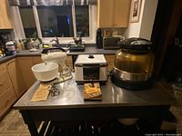 Kitchen counter with visible Hamilton Beach mixer, Preston deep fryer, and NuWave oven positioned side by side.