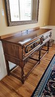Full front angled view of buffet showing overall design, two drawers and finish.