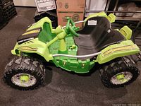 Three photos showing different angles of a green and black two seat Power Wheels ride-on vehicle with large off-road style tires, black molded seats, steering wheel, and visible wear on decals and body panels.