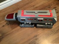 Side view of the Gobots Command Centre toy vehicle showing canopy and tank-like tread wheels.