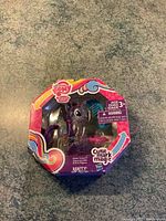 Front view of sealed My Little Pony Cutie Mark Magic Rarity toy in packaging showing logo, character, and box condition.