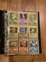 First binder page showing Beedrill, Mewtwo, Nidoking, Electabuzz (holo), Poliwrath (holo), Raichu (holo), Arcanine, Charmeleon, Dewgong