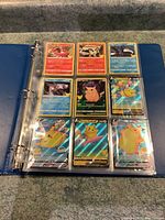 Photo showing 9 cards in a sleeve including Charizard, Pikachu variants (Flying Pikachu V and others), and other Pokémon cards.