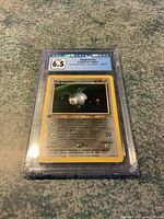 Magnemite Pokémon card graded 6.5 by CGC in hard plastic slab showing front design and label at top