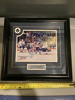 Full framed photo of Doug Gilmour in action, signed and matted with nameplate and team logo