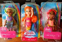 Photo shows three Barbie Dreamtopia Chelsea dolls in original packaging, viewable from the front with clear plastic covers.