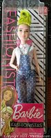 Photo of Barbie Fashionistas Doll #124 with bright neon green hair in packaging, showing front view with outfit and branding visible.