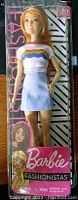 Barbie Fastionista doll #122 in original packaging showing doll dressed in white rainbow crop top and blue skirt, unopened and new in box.