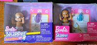Two Barbie Skipper Babysitters Inc baby dolls in original packaging, showing front of boxes with dolls and accessories visible.