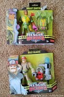 Two Fisher Price Rescue Heroes figures in original packaging: Rocky Canyon and Billy Blazes.