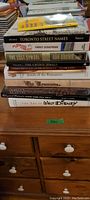 Stack of 12 books showing titles and spine conditions suitable for identification and verification.