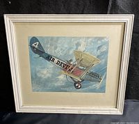 Full front view of framed Curtiss JN-4D 1919 Air Devils print showing airplane in flight and frame with matte.