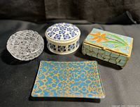 Four items including crystal trinket box, porcelain Delfts Jasmijn box, glass mosaic trinket box, and blue gold dish