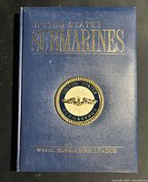 Front cover of a blue hardcover book with gold embossed title 'United States Submarines' and Naval Submarine League emblem.