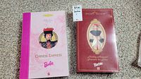 Two Barbie dolls in original boxes, Chinese Empress and Holiday Memories models.