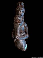 Image showing full front view of metal mother and child sculpture highlighting form and detailing.
