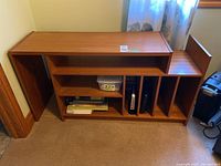 Front view showing full cabinet with open shelving and extension panel retracted