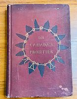 Front cover of maroon hardcover book titled 'On Canada's Frontier' with black and gold decoration.
