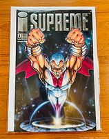 Full front cover of Supreme #1 comic showing the character flying over Earth with silver foil title.