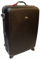 Large black Samsonite hard case suitcase showing textured hard shell, top handle, and wheel.