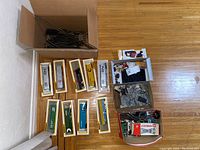 Freight cars and boxes laid out on floor