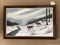 Framed original painting by Irene Kennedy depicting five wolves in snowy landscape with river and trees, measuring 15 x 23 inches.