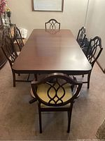 Front view of table with chairs in room