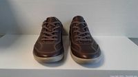 Front view of the brown Ecco Colin size 44 men's shoes showing lace-up leather upper and rubber sole.