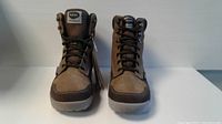 Front view of brown and tan Hi-Tec Sierra women's boots with laces and brand label on tongue.