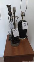 Three lamps arranged on wooden surface showing overall condition and styles.