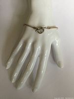 Bracelet on display, showing overall length and fit on hand model