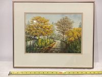 Photo of the full framed watercolor painting showing autumn landscape with pathway and trees.