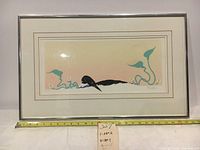 Full front view showing the framed Aboriginal serigraph artwork with a measuring tape indicating frame dimensions around 26 inches wide and 16 inches high