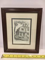 Full view of framed engraving with measuring tape showing frame width around 9.5 inches.