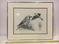 Full view of framed original ink drawing showing the entire artwork and frame with measuring tape in front to show size.