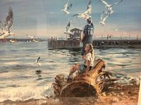 Close-up image showing the impressionist artwork with people and seagulls near a pier by the water during sunset or sunrise.
