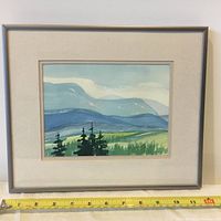 Full view of framed watercolor painting 'Monashee Hills' with measuring tape showing size