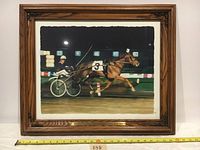 Framed watercolor painting showing harness racehorse with driver in sulky at the race, full view with measurement tape indicating frame width.