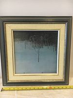 Framed print with measuring tape indicating frame dimensions around 17.5 inches wide and 17 inches high.