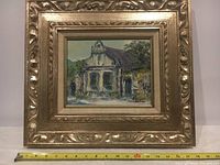 Framed oil painting on board showing the full artwork and frame with measuring tape indicating size.