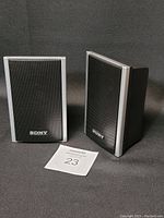 Pair of Sony SS-TS80 bookshelf speakers front view, black with silver trim and mesh grille showing Sony logos.