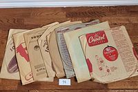 Eight 10 inch vintage records in original paper sleeves from various labels including Capitol and Columbia Records.