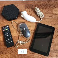 Top view showing all 5 electronic items on wooden surface