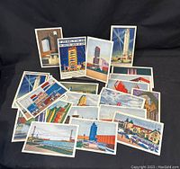 Photo showing a group of 17 postcards from the 1933 Chicago World's Fair laid out with various colorful illustrations and buildings.
