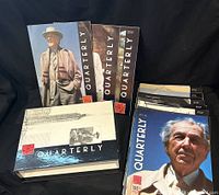 Collector's box and magazine volumes arranged upright and flat showing covers and box design